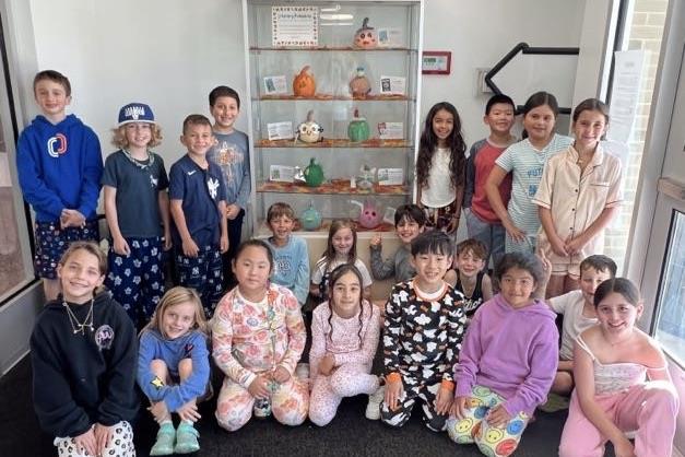  students with pumpkins